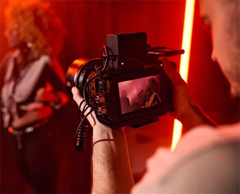 Camera operator filming a band