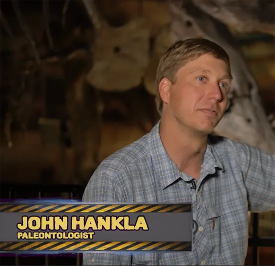 A videographer filming an interview