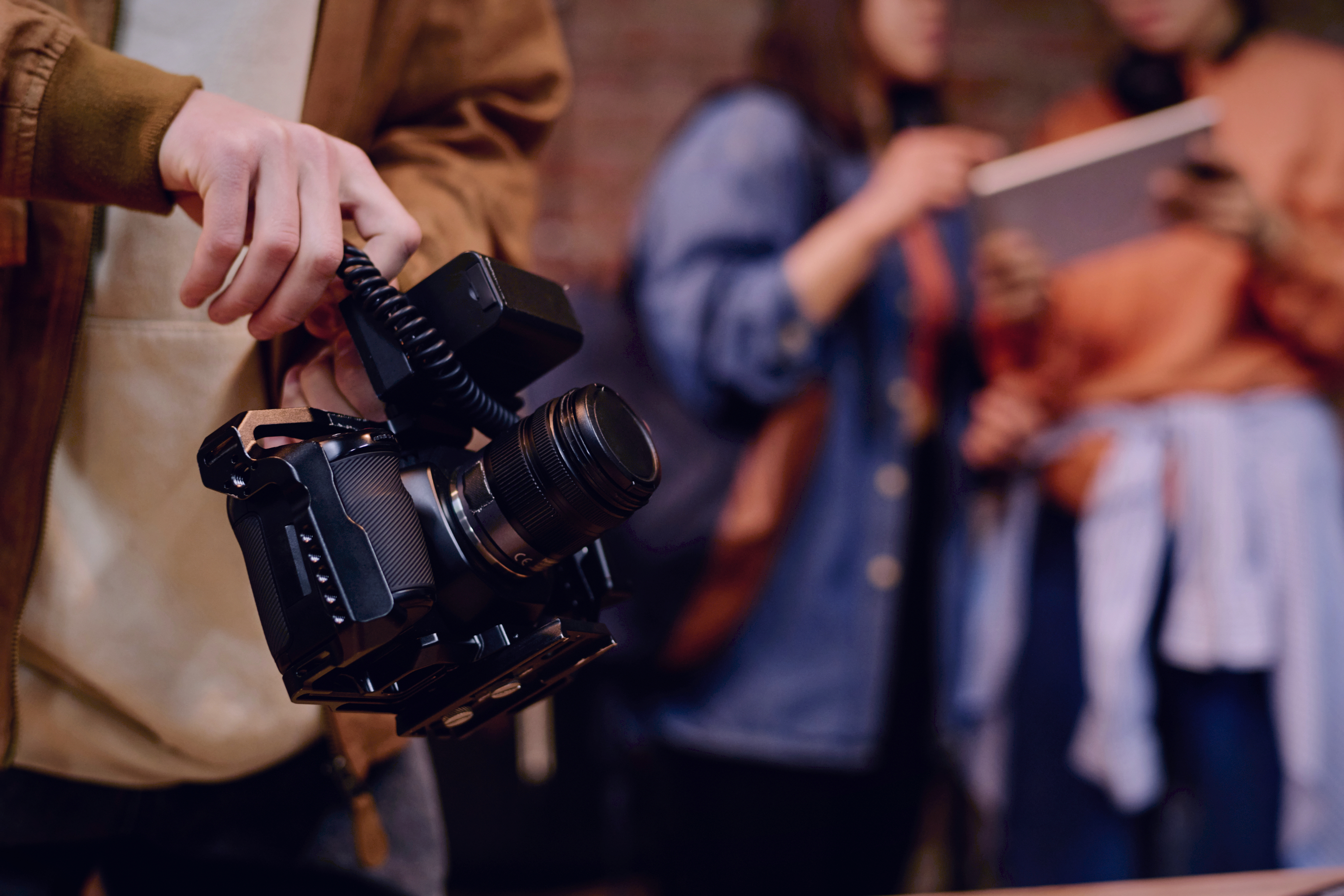 Camera operator with production gear on location